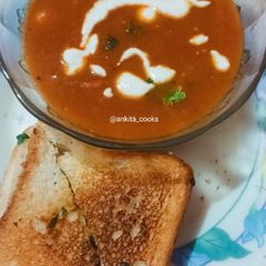 A picture of Roasted Tomato Soup with Cheese Garlic Bread.