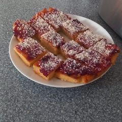 Jam and Coconut traybake A picture of Jam and Coconut traybake.