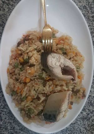 A picture of Concoction rice and boiled fish.