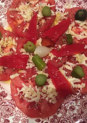 A picture of Tomato with Manchego Cheese.
