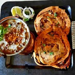 Dal Bukhara With GarlicLachcha Paratha A picture of Dal Bukhara With GarlicLachcha Paratha.