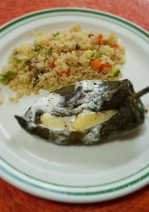 A picture of Chiles Rellenos with Beans and Cheese.