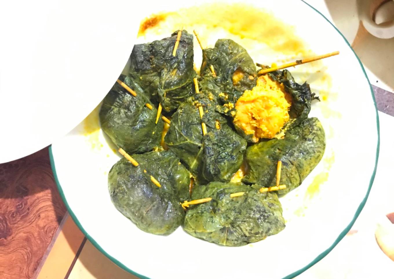 Steamed shrimp in pumpkin leaves