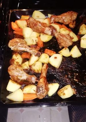 A picture of One pan meal baked Potatoes and chicken.