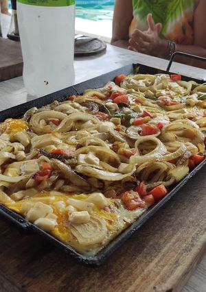 Una foto de Papas chorreadas