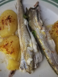 Una foto de Pescada al horno con patatas
