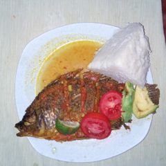 A picture of Tilapia fish with ugali.