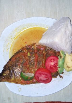 A picture of Tilapia fish with ugali.