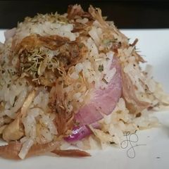A picture of Roasted Lamb Shanks And Onion Fried Rice.