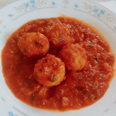 A picture of Meatballs in tomato sauce.