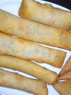 A picture of Home made spring rolls and samosa.