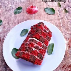 A picture of Chocolate and red velvet checker board cake.