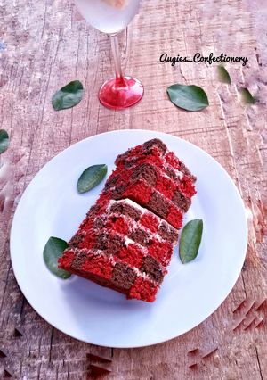 A picture of Chocolate and red velvet checker board cake.