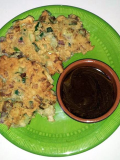 A picture of Cucumber Fritters with Peanut Sauce.
