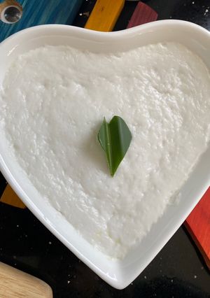 A picture of Pandan Coconut Steamed Cups (Khanom Tuay) with Soft Texture and Beautiful Coconut Cream Layer.