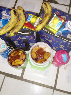 A picture of White Rice and Stew with Fried plaintain.