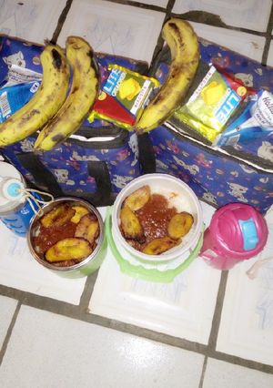 A picture of White Rice and Stew with Fried plaintain.