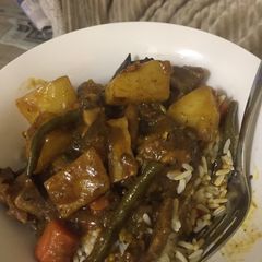 A picture of Beef stew with rice.