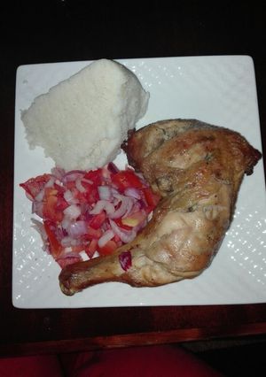 A picture of Grilled chicken, Kachumbari and Ugali #Chickencontest#.
