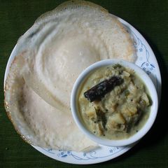 A picture of Appam with Vegetable Stew.