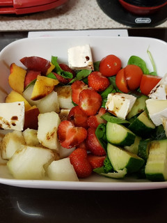 A picture of My Melon & Strawberry Salad with Raspberry Balsamic vinegar. 😙.
