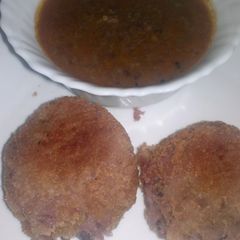 A picture of Crunchy stuffed arrow roots with minced meat sauce.