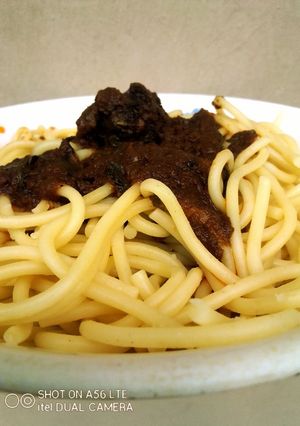 A picture of Nigerian Curry Stew on Pasta.