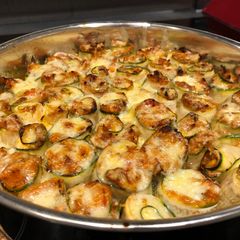 A picture of Spicy chicken in zucchini roll-ups.