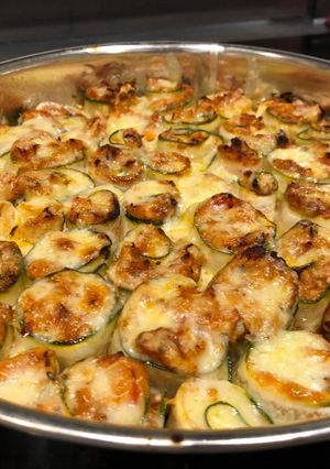 A picture of Spicy chicken in zucchini roll-ups.