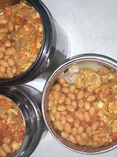 A picture of Boiled yam, egg sauce and baked beans by the side!.