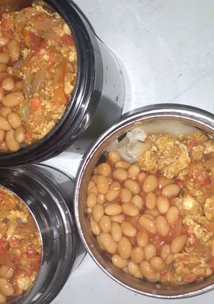 A picture of Boiled yam, egg sauce and baked beans by the side!.