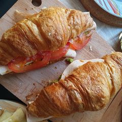 A picture of Turkey Avocado Croissant Sandwich.