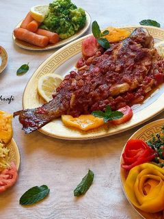صورة لوصفة سمكة مشوية بصلصة البندورة