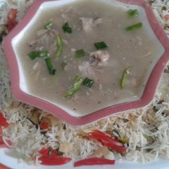 A picture of Fried rice with chicken chilli.