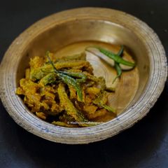 A picture of Uchhe-Kumro Chenchhki Kasundi diye (Karela-Kumra dry with Kasundi).