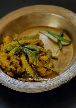 A picture of Uchhe-Kumro Chenchhki Kasundi diye (Karela-Kumra dry with Kasundi).