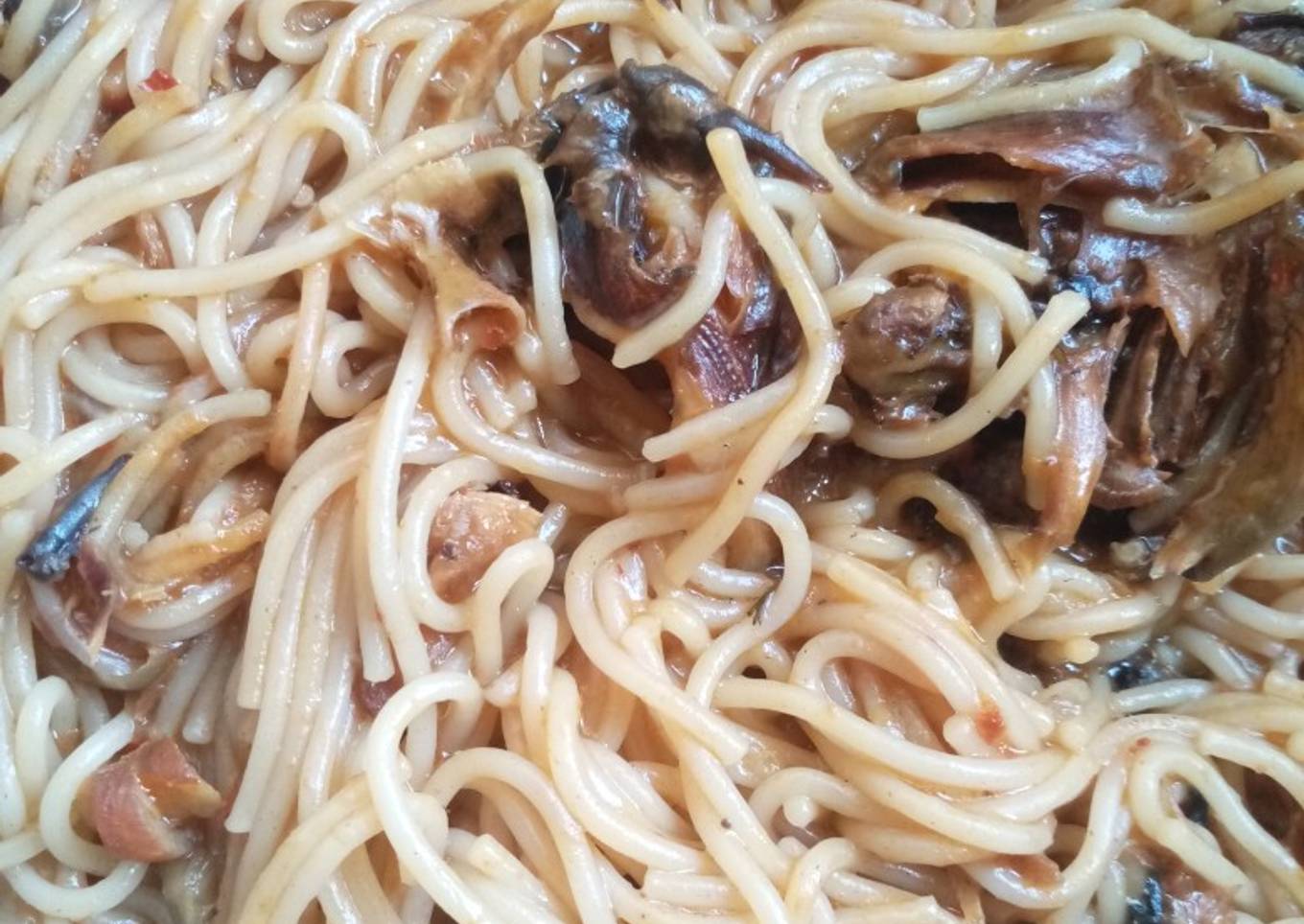 Jollof spaghetti with dried fish