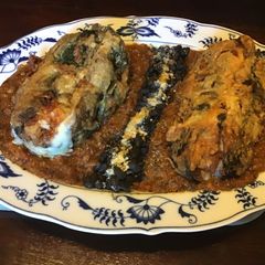 A picture of California Farm Cheese Stuffed Poblano Peppers in Red Sauce.