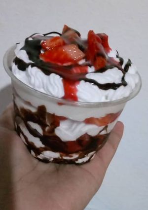 Una foto de Fresas con crema y chocolate