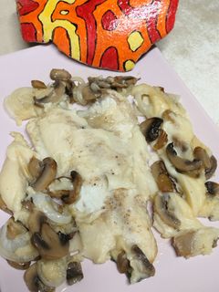 Una foto de Filetes de dorada con champiñones