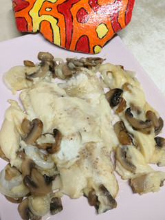 Una foto de Filetes de dorada con champiñones