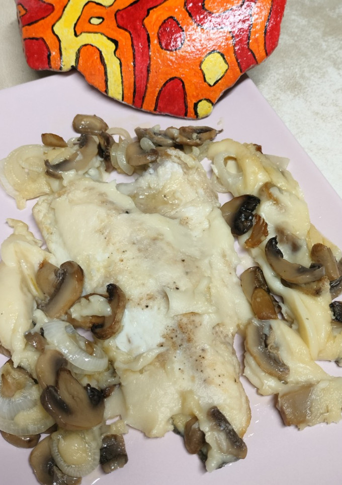 Una foto de Filetes de dorada con champiñones