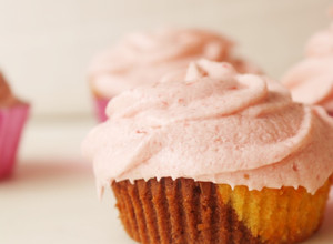 A picture of Neapolitan Cupcakes - Chocolate & Vanilla Sponge Cake with Fresh Strawberry Buttercream Frosting.