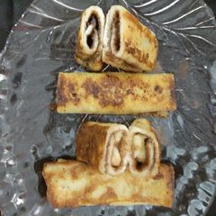 French toast filled with chocolate and banana A picture of French toast filled with chocolate and banana.