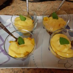 A picture of Fruit and custard pots.