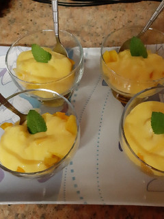 A picture of Fruit and custard pots.