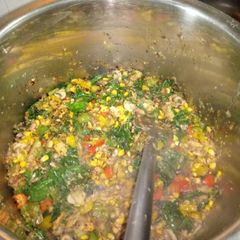 A picture of Spinach corn sausage rice.