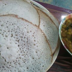 A picture of Appam and veg kurma.
