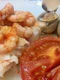 Merluza al horno con gamba y berberechos