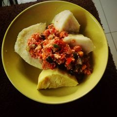 A picture of Boiled potatoes and egg sauce.